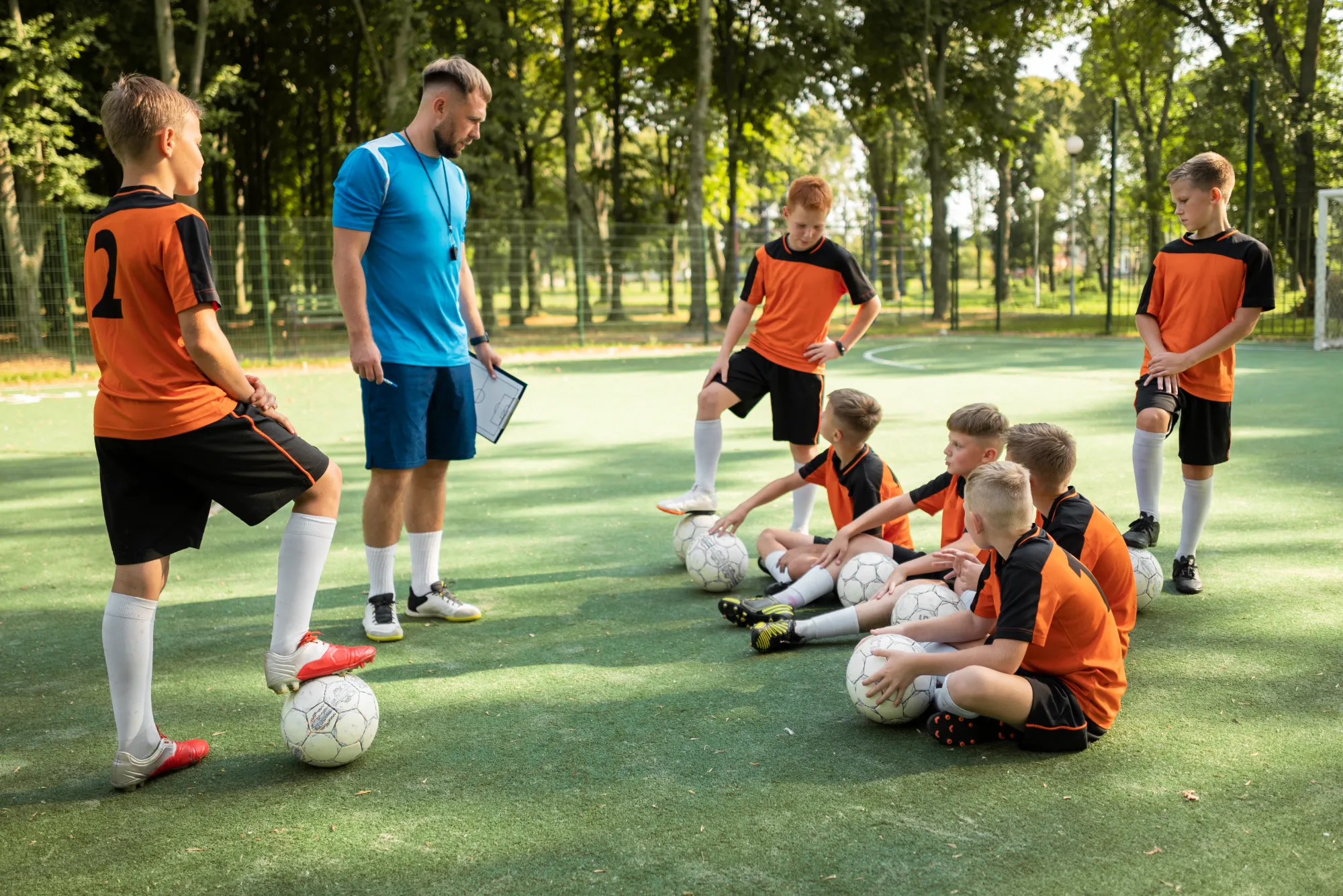 football-trainer-teaching-his-pupils